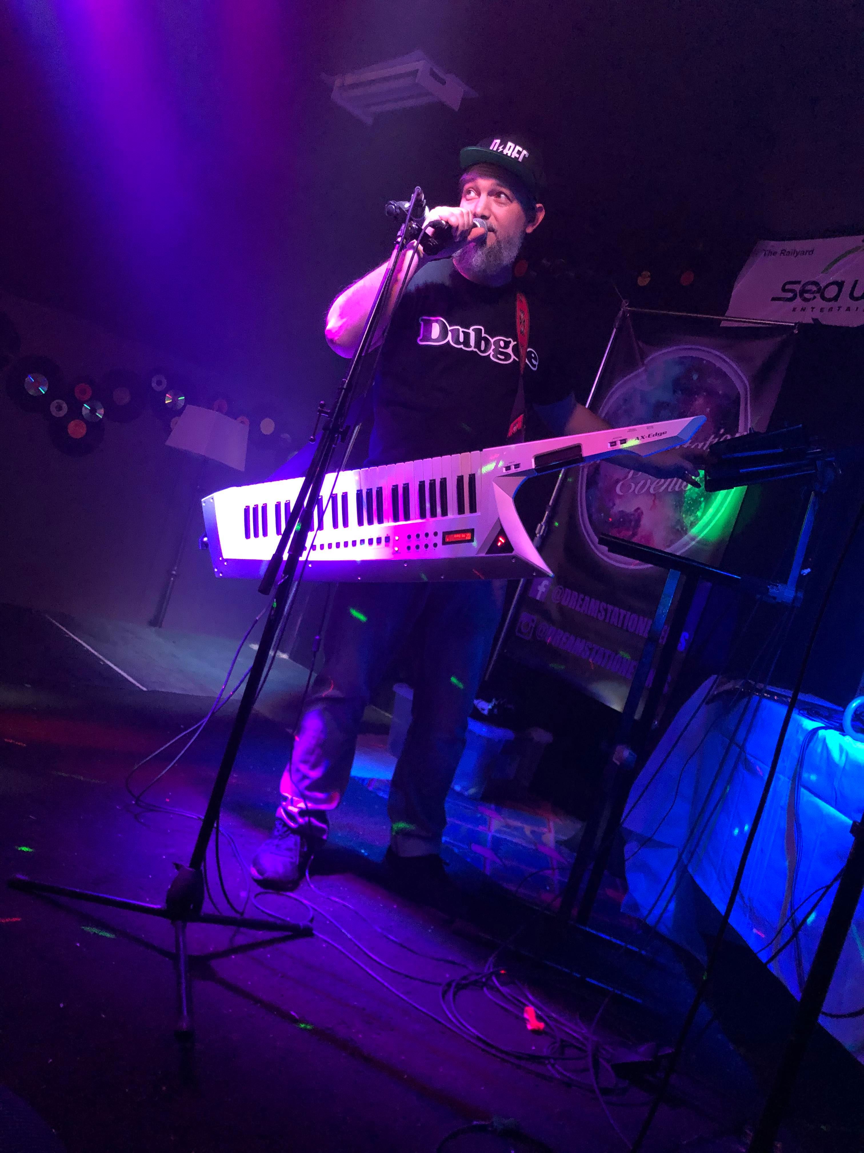 Dubgee performing live with a keytar